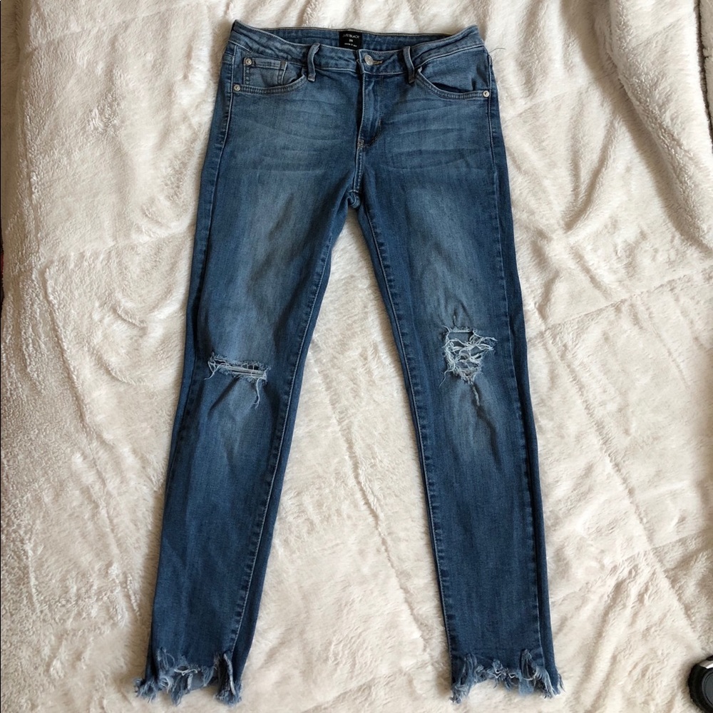 Distressed ankle jeans